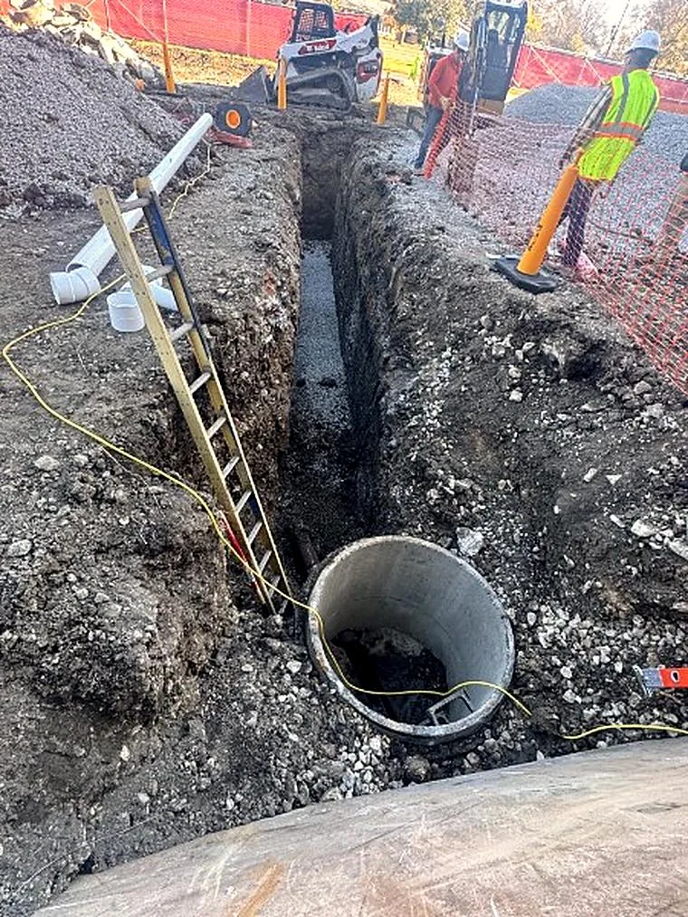 Concrete structure set in a deep trench at Glenbard East HS