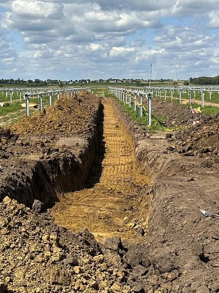Long open trench cut across a jobsite